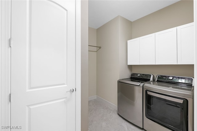17021 Ashcomb Way, Estero, FL 33928 - washroom featuring washer and clothes dryer and cabinet space