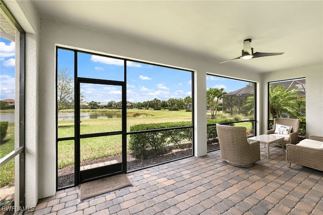 17021 Ashcomb Way, Estero, FL 33928 - sunroom with a water view and ceiling fan