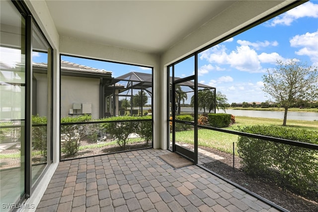 17021 Ashcomb Way, Estero, FL 33928 - unfurnished sunroom with a water view