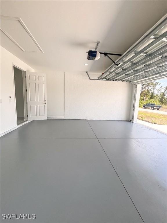 3413 28th St SW, Lehigh Acres, FL 33976 - garage featuring a garage door opener