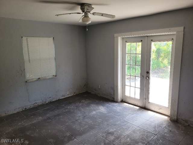 137 Standish Cir, North Fort Myers, FL 33903 - empty room with french doors and ceiling fan
