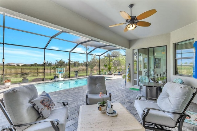 11693 Canopy Loop, Fort Myers, FL 33913 - outdoor pool featuring a patio area, a ceiling fan, and glass enclosure