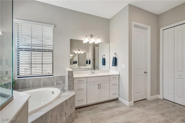 11693 Canopy Loop, Fort Myers, FL 33913 - bathroom with a closet, vanity, a garden tub, and a chandelier