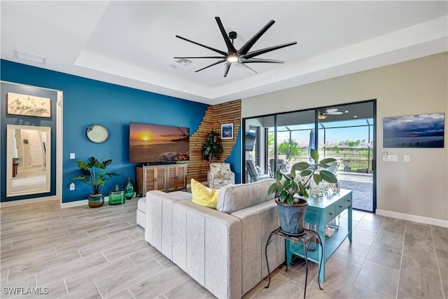 11693 Canopy Loop, Fort Myers, FL 33913 - living area featuring baseboards, ceiling fan, and a raised ceiling