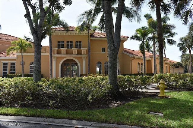 8754 River Homes Ln Unit 8205, Bonita Springs, FL 34135 - view of front of home with stucco siding and a tiled roof