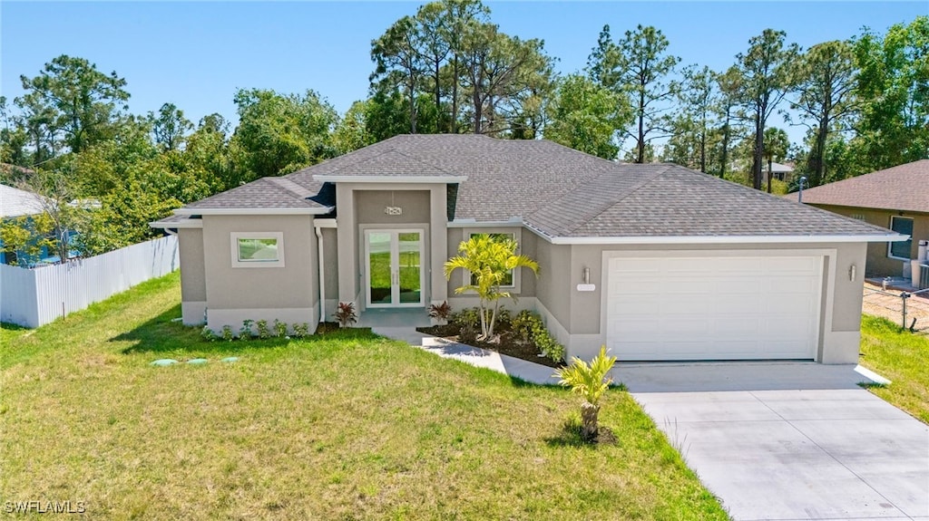 3815 15th St W, Lehigh Acres, FL 33971 - view of front of house featuring stucco siding, an attached garage, concrete driveway, and a shingled roof