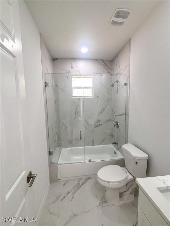 3806 15th St W, Lehigh Acres, FL 33971 - full bathroom with enclosed tub / shower combo, vanity, toilet, marble finish floors, and baseboards