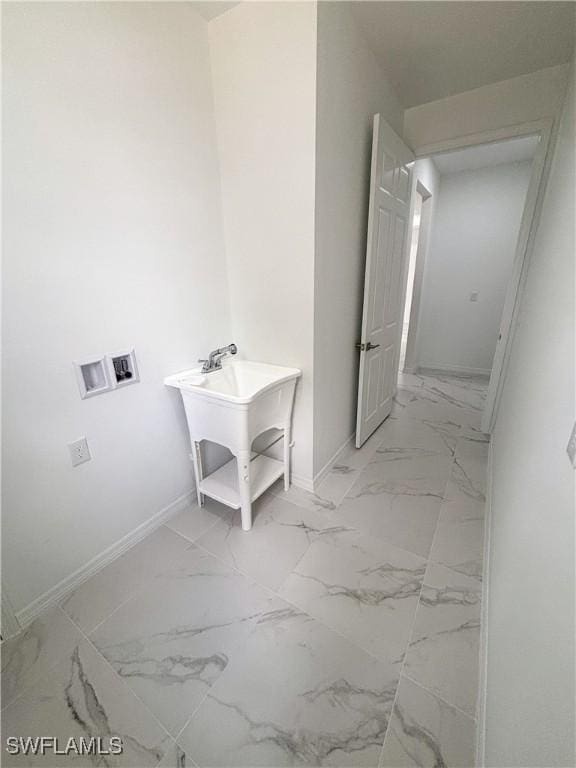 3806 15th St W, Lehigh Acres, FL 33971 - laundry area featuring hookup for a washing machine, baseboards, and light marble finish floors