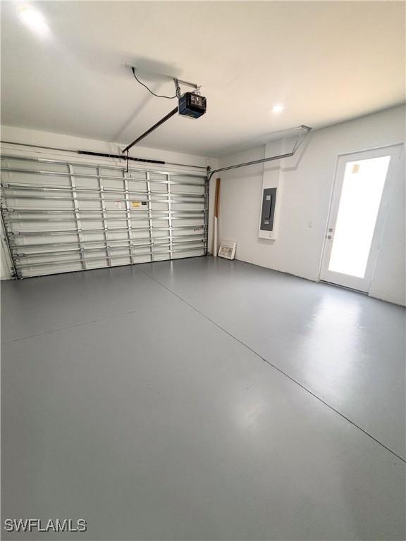 3806 15th St W, Lehigh Acres, FL 33971 - garage with electric panel and a garage door opener