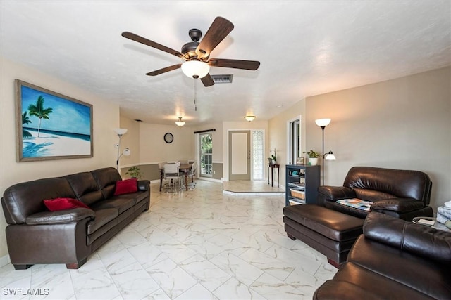 1704 Coral Way N, Fort Myers, FL 33917 - living area with light marble finish flooring, a ceiling fan, and baseboards
