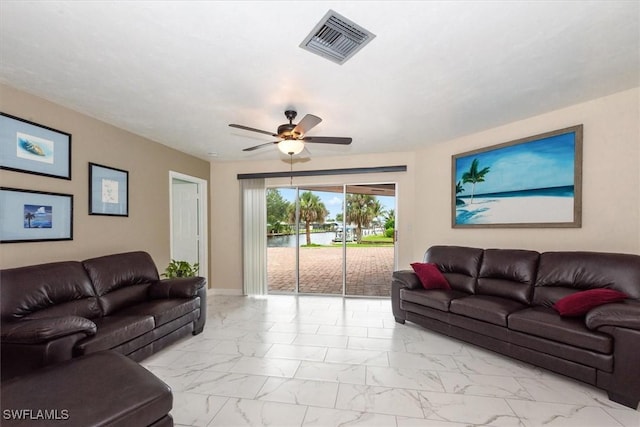 1704 Coral Way N, Fort Myers, FL 33917 - living room with light marble finish floors, a ceiling fan, and baseboards