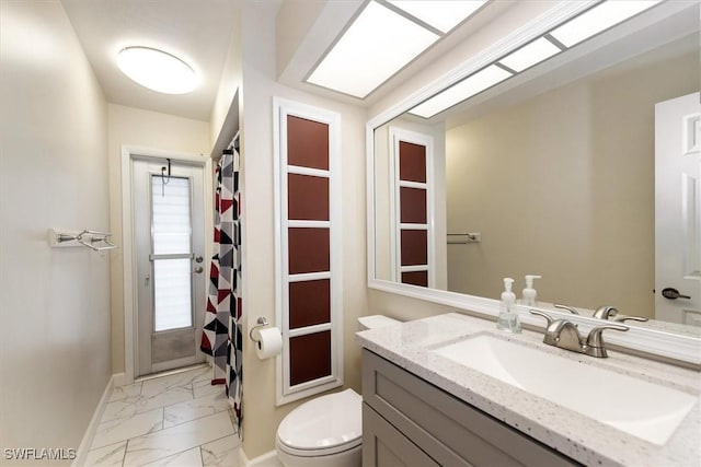 1704 Coral Way N, Fort Myers, FL 33917 - bathroom featuring marble finish floors, vanity, toilet, baseboards, and curtained shower