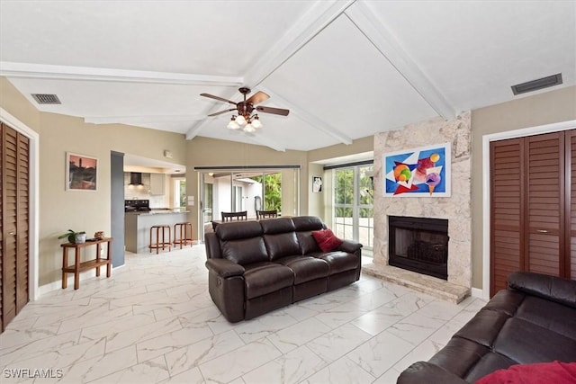 1704 Coral Way N, Fort Myers, FL 33917 - living room featuring light marble finish floors, a ceiling fan, a stone fireplace, and baseboards