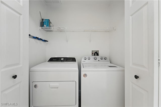 411 Valerie Way Unit 103, Naples, FL 34104 - laundry room with washing machine and dryer