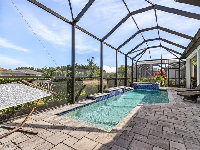 8341 Promoso Ct, Naples, FL 34114 - view of pool with a patio, a pool with connected hot tub, and a lanai