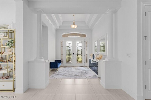 8341 Promoso Ct, Naples, FL 34114 - tiled entryway with decorative columns, ornamental molding, french doors, and a raised ceiling
