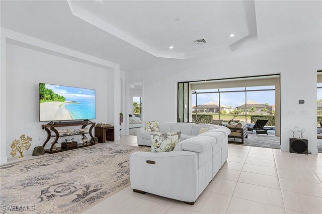 8341 Promoso Ct, Naples, FL 34114 - living area with a raised ceiling, light tile patterned floors, and recessed lighting