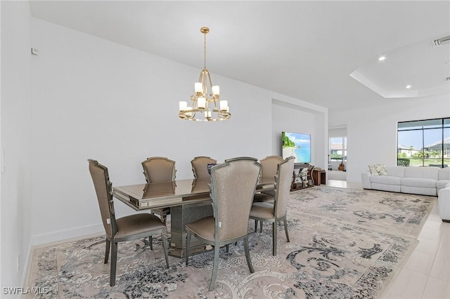 8341 Promoso Ct, Naples, FL 34114 - tiled dining space featuring a chandelier, recessed lighting, and a tray ceiling