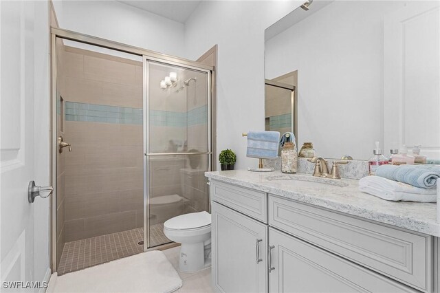 8341 Promoso Ct, Naples, FL 34114 - bathroom featuring vanity, a stall shower, and tile patterned flooring