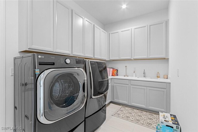 8341 Promoso Ct, Naples, FL 34114 - laundry room with independent washer and dryer, cabinet space, and light tile patterned floors