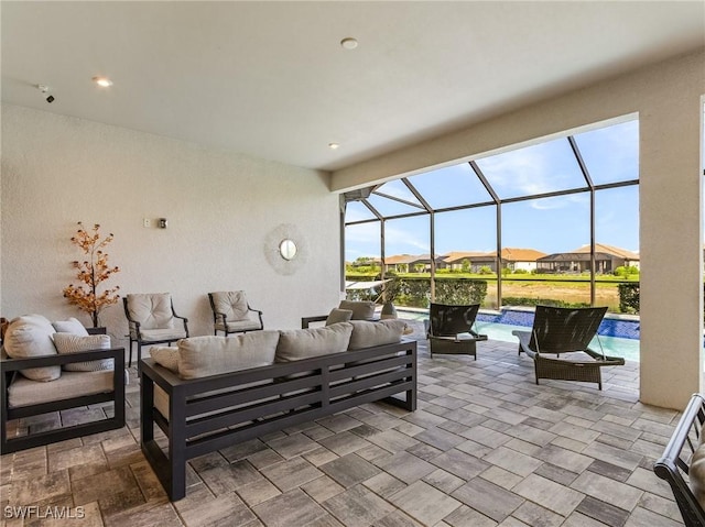 8341 Promoso Ct, Naples, FL 34114 - view of patio / terrace with an outdoor living space, an outdoor pool, a lanai, and a residential view