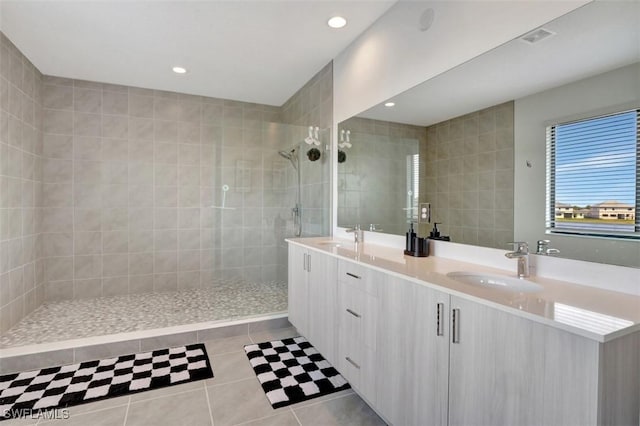 5273 Lamone Ln, Ave Maria, FL 34142 - bathroom featuring double vanity, tile patterned floors, a walk in shower, and recessed lighting