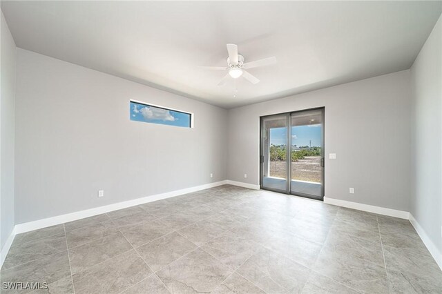 2458 NW 21st Ter, Cape Coral, FL 33993 - spare room featuring ceiling fan and baseboards