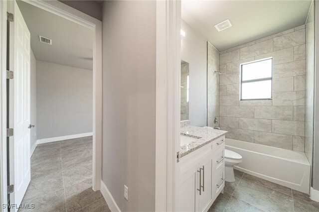 2458 NW 21st Ter, Cape Coral, FL 33993 - full bathroom with vanity, toilet, shower / bathtub combination, tile patterned flooring, and baseboards