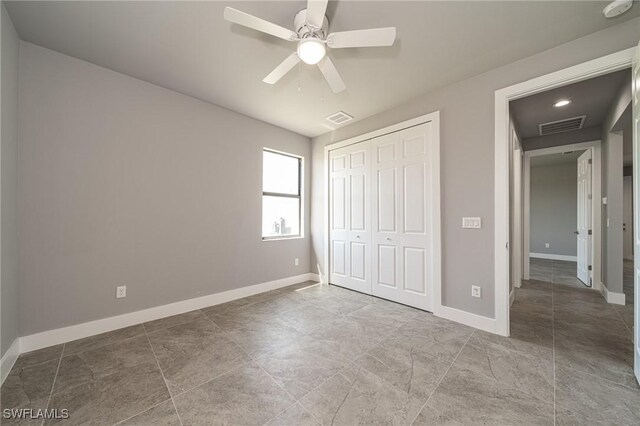 2458 NW 21st Ter, Cape Coral, FL 33993 - unfurnished bedroom with a closet and baseboards