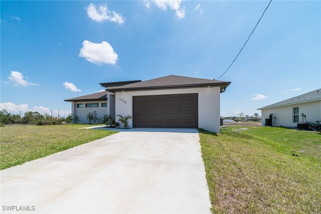 2458 NW 21st Ter, Cape Coral, FL 33993 - view of front of house featuring stucco siding, concrete driveway, a front lawn, and a garage