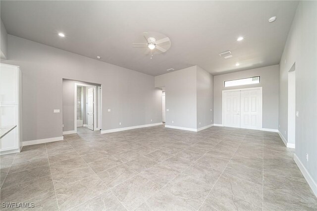 2458 NW 21st Ter, Cape Coral, FL 33993 - spare room with ceiling fan, recessed lighting, baseboards, and a smoke detector
