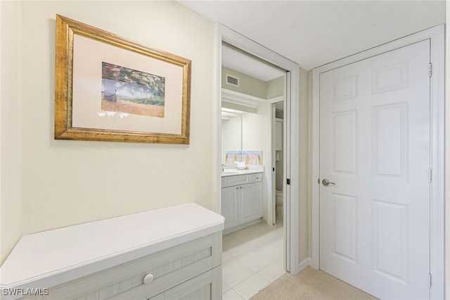 8771 Estero Blvd Unit 807, Fort Myers Beach, FL 33931 - corridor featuring a sink and light tile patterned flooring