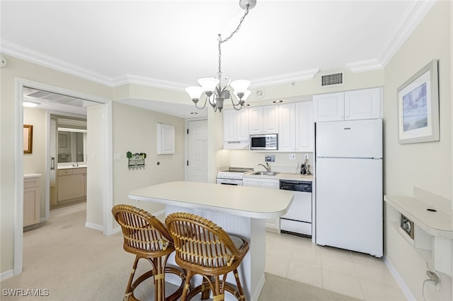 8771 Estero Blvd Unit 807, Fort Myers Beach, FL 33931 - kitchen with white appliances, a chandelier, a kitchen bar, a sink, and light countertops