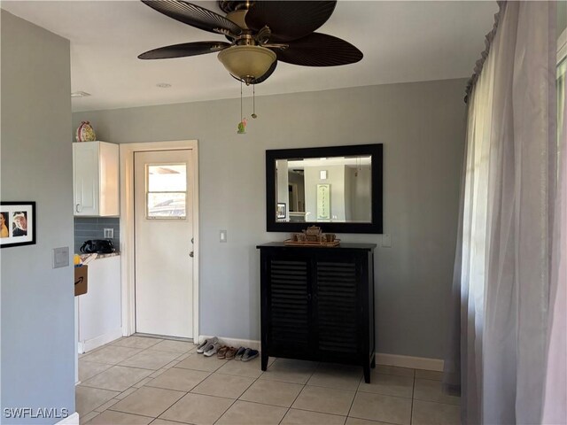 2440 Elkcam Blvd, Port Charlotte, FL 33952 - interior space with light tile patterned flooring, a ceiling fan, and baseboards