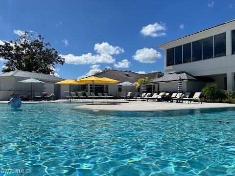 10951 Callaway Greens Ct, Fort Myers, FL 33913 - community pool featuring a patio