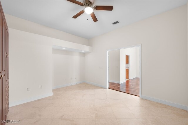 14221 Patty Berg Dr, Fort Myers, FL 33919 - spare room with a ceiling fan and baseboards
