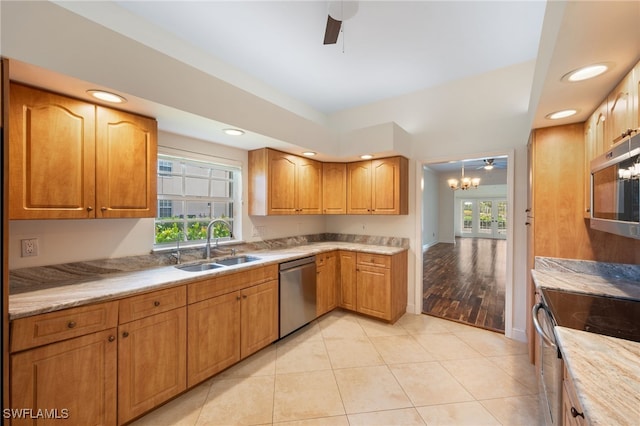 14221 Patty Berg Dr, Fort Myers, FL 33919 - kitchen featuring stainless steel appliances, a sink, ceiling fan, light countertops, and recessed lighting
