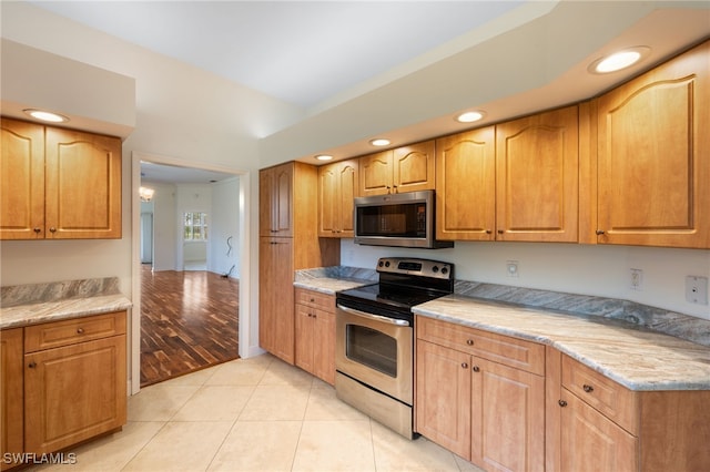 14221 Patty Berg Dr, Fort Myers, FL 33919 - kitchen featuring stainless steel appliances, light tile patterned flooring, and recessed lighting