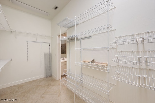 14221 Patty Berg Dr, Fort Myers, FL 33919 - walk in closet featuring tile patterned flooring and a sink