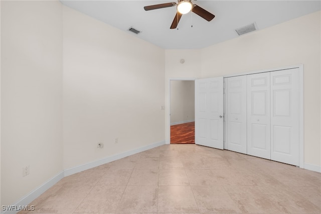14221 Patty Berg Dr, Fort Myers, FL 33919 - unfurnished bedroom featuring baseboards, ceiling fan, and a closet