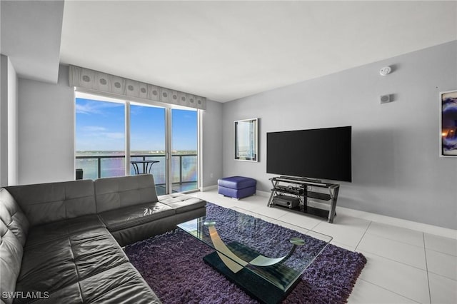 3000 Oasis Grand Blvd Unit 2103, Fort Myers, FL 33916 - living area featuring tile patterned floors and baseboards