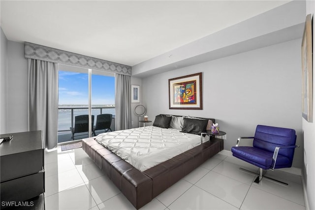 3000 Oasis Grand Blvd Unit 2103, Fort Myers, FL 33916 - tiled bedroom featuring a water view and baseboards