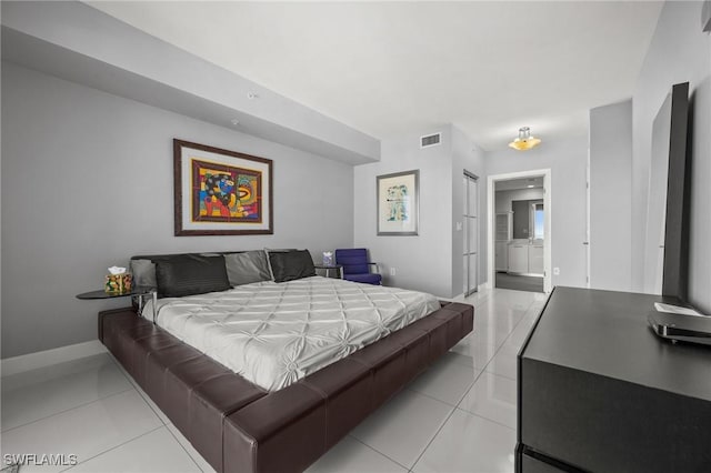 3000 Oasis Grand Blvd Unit 2103, Fort Myers, FL 33916 - bedroom featuring light tile patterned flooring and ensuite bath