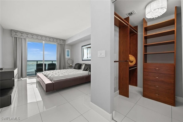 3000 Oasis Grand Blvd Unit 2103, Fort Myers, FL 33916 - bedroom with light tile patterned floors and access to outside