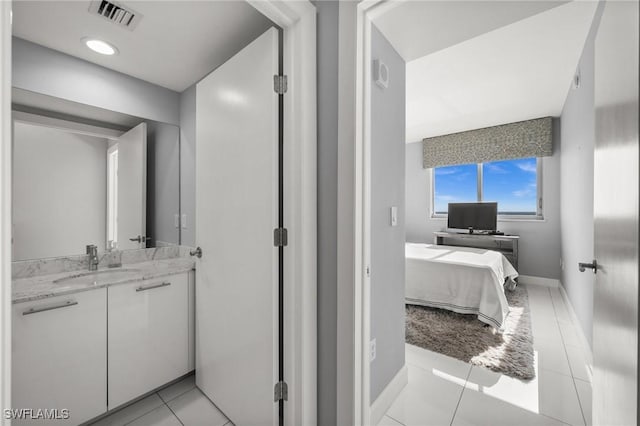 3000 Oasis Grand Blvd Unit 2103, Fort Myers, FL 33916 - bathroom with vanity and tile patterned flooring