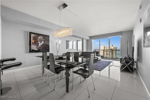 3000 Oasis Grand Blvd Unit 2103, Fort Myers, FL 33916 - dining space with tile patterned floors and baseboards