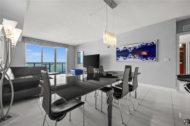 3000 Oasis Grand Blvd Unit 2103, Fort Myers, FL 33916 - dining room with tile patterned floors