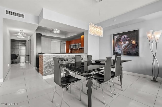 3000 Oasis Grand Blvd Unit 2103, Fort Myers, FL 33916 - dining space with baseboards and light tile patterned floors