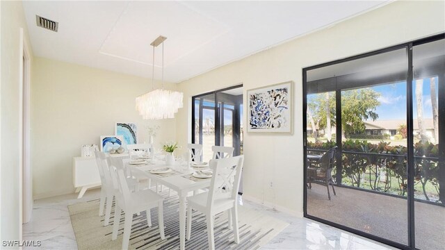 319 Reynolds Ct Unit M12, Naples, FL 34112 - dining room featuring marble tiled flooring and a chandelier