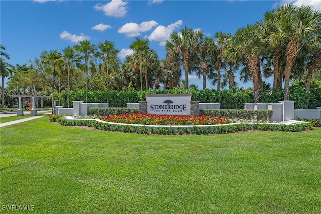 1630 Winding Oaks Way Unit 102, Naples, FL 34109 - community sign featuring a lawn